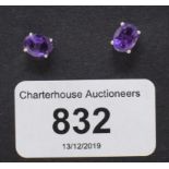 A pair of amethyst stud earrings, boxed