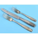 An Adolf Hitler formal pattern silver coloured metal table knife, with a steel blade, with a