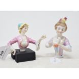 A porcelain half doll, probably Dressel & Kister, lady wearing a cap and a pink dress, arms away, 11