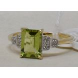 A 9ct gold, peridot and diamond shoulder ring