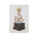 A Henri Delcourt porcelain half doll, nude lady with blonde hair, arms pointing out and down, 8.5 cm