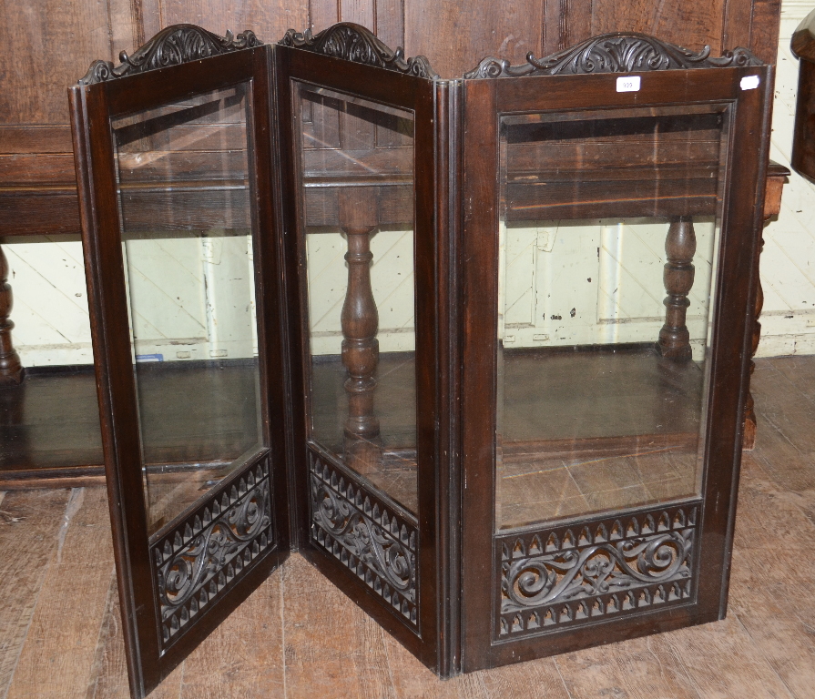 A carved and pierced three fold screen, 111 cm high