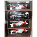A Paul's Model Art McLaren Collection 1:18 die-cast model Formula 1 car, and three others, all boxed