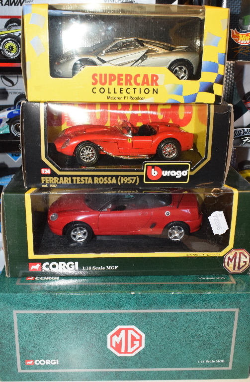 A Corgi 1:18 die-cast model MGB, and eight others, all boxed (9)