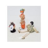 A porcelain half doll, assembly, flapper head with black hair, pin cushion body in green, 20 cm