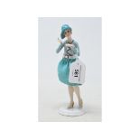 A porcelain half doll original assembly, lady wearing a turquoise dress and matching hat, 20 cm high