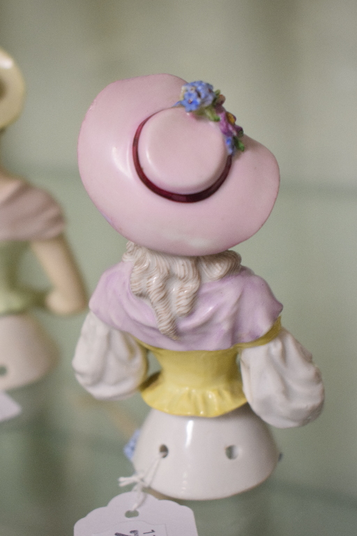 A porcelain half doll, lavender hat and scarf, holding flowers and wearing a yellow corset, 12 cm - Image 5 of 5