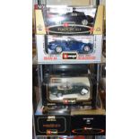 A Burago 1:18 die-cast model Porsche 911 Carrera 1997, and four others, all boxed (5)