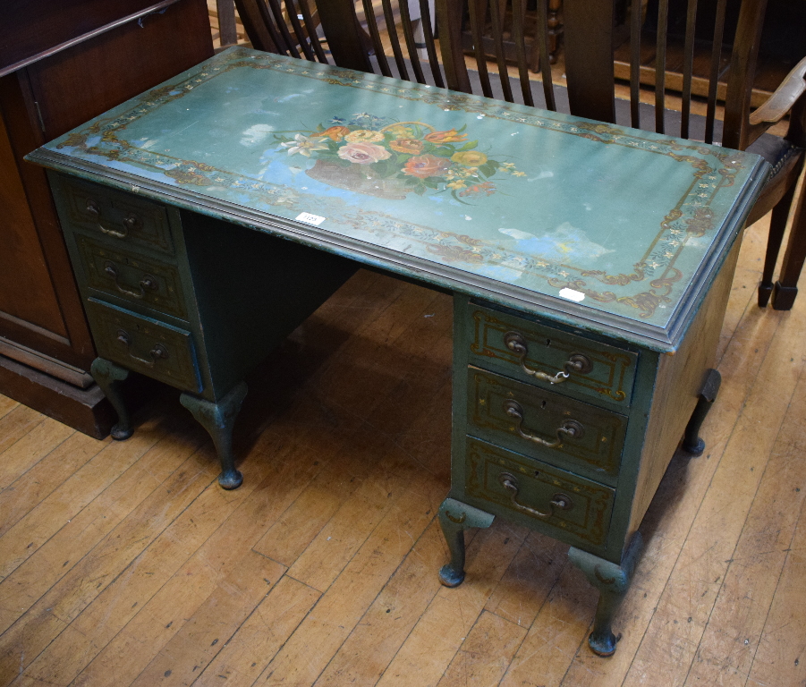 A kneehole desk, with floral painted decoration on a turquoise ground, 107 cm wide
