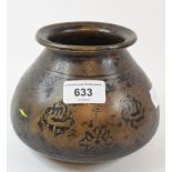 An Islamic brass vessel, of compressed baluster form, decorated foliage and calligraphy, 12 cm high