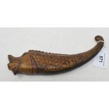 An Indian carved wood powder flask, in the form of a fish, with gilt decoration, 22 cm wide