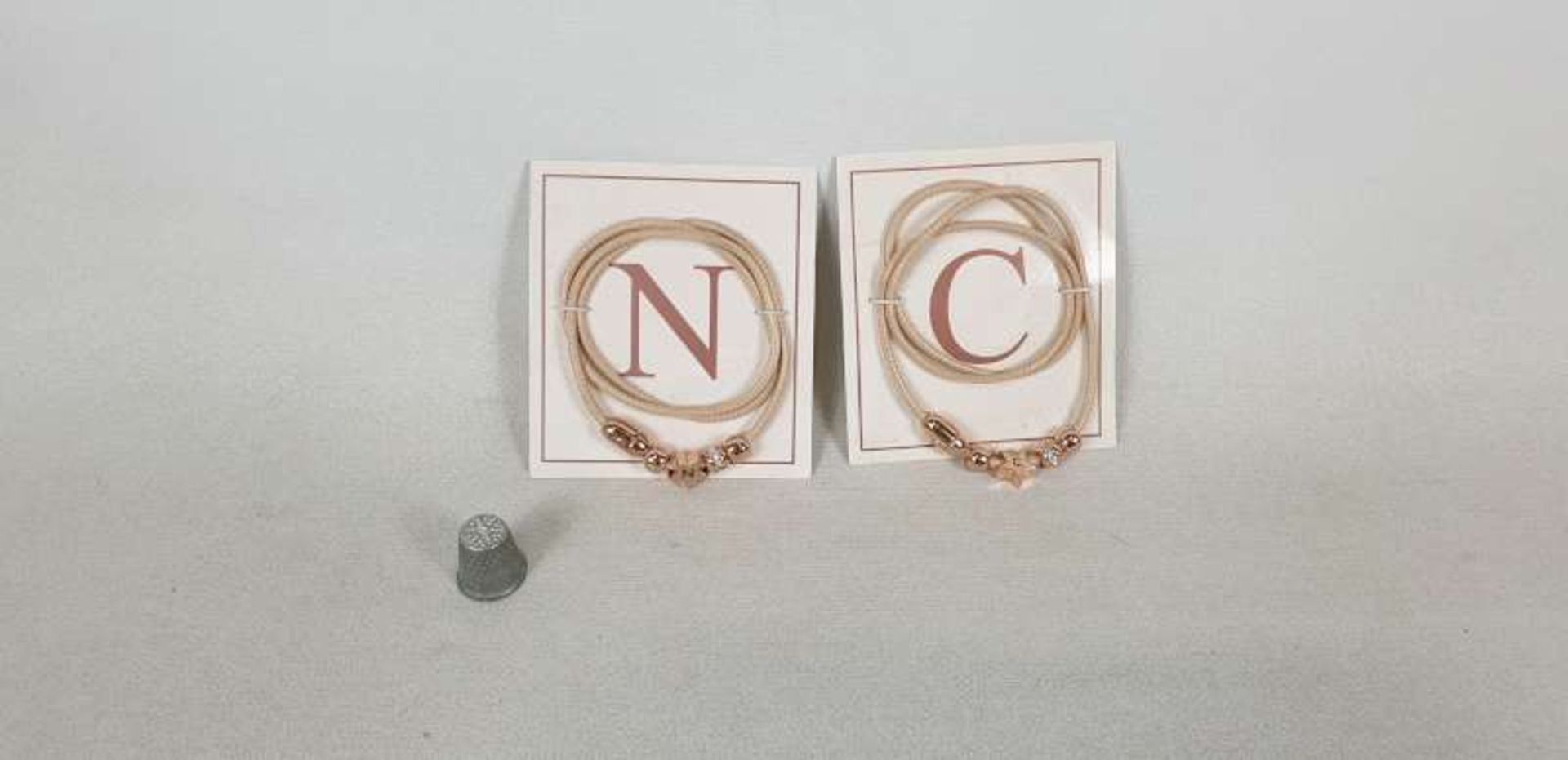 120 X AVON MELANNE ROSE GOLD COLOURED INITIALS ( N & C ) WRAP BRACELETS IN 2 BOXES