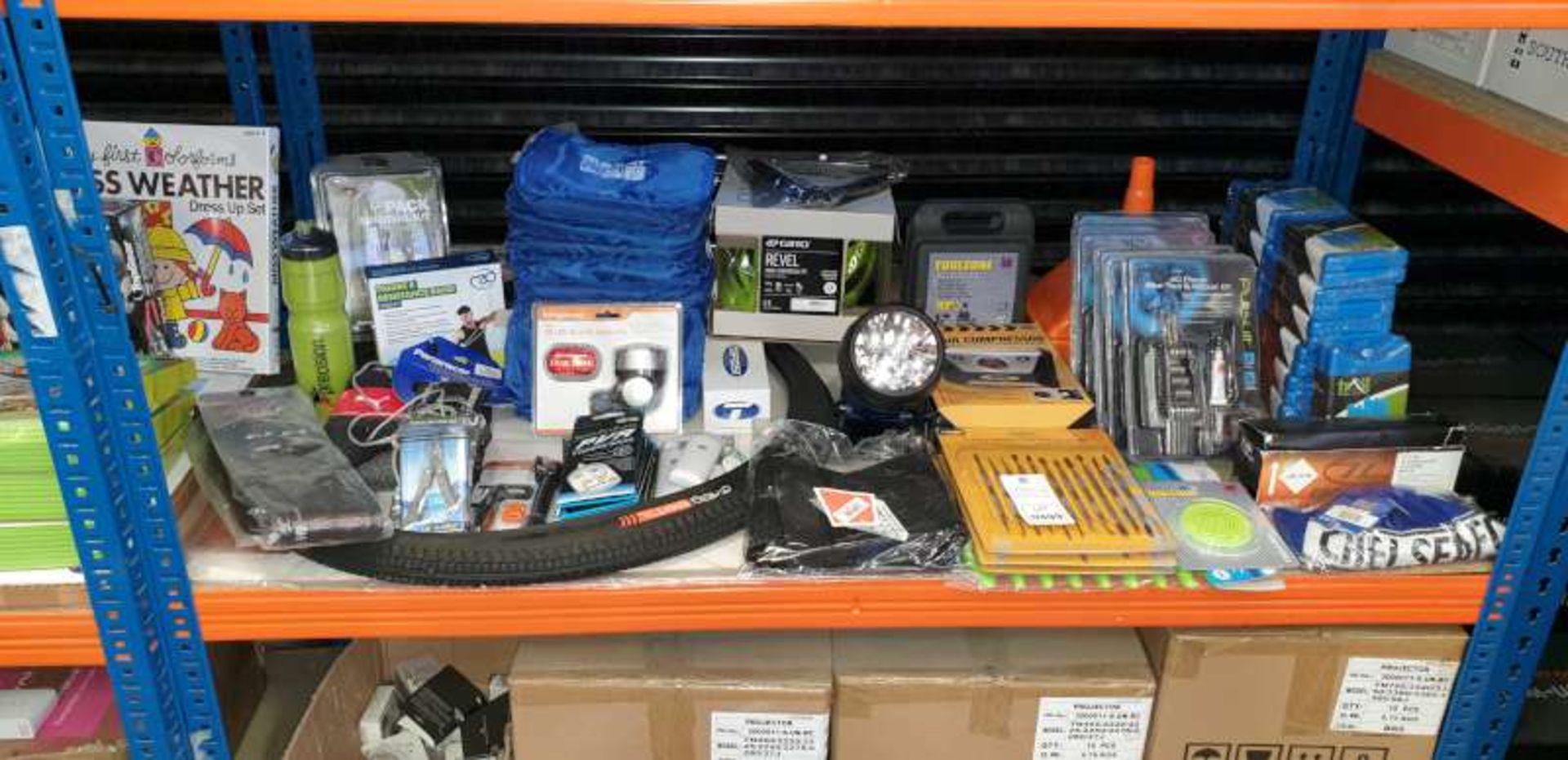 SHELF CONTAINING 30 PIECE BIKE TOOL AND REPAIR KITS, ICE PACKS, TORCH, BIKE TYRES, GO PACK SURVIAL