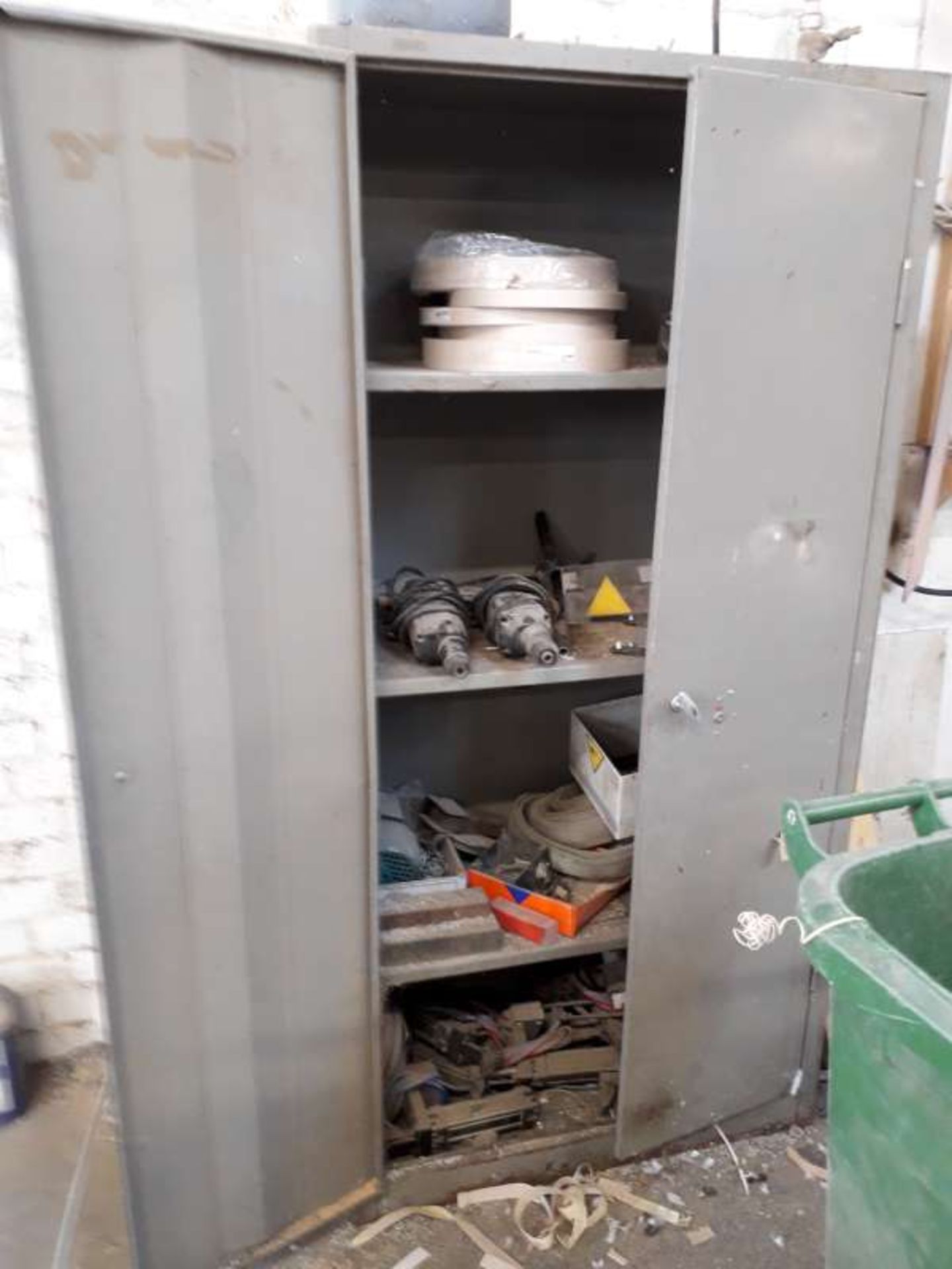 GREY, 6FT 2 DOOR METAL CABINET WITH 2 HEAVY DUTY DRILLS AND A SMALL MOTOR.