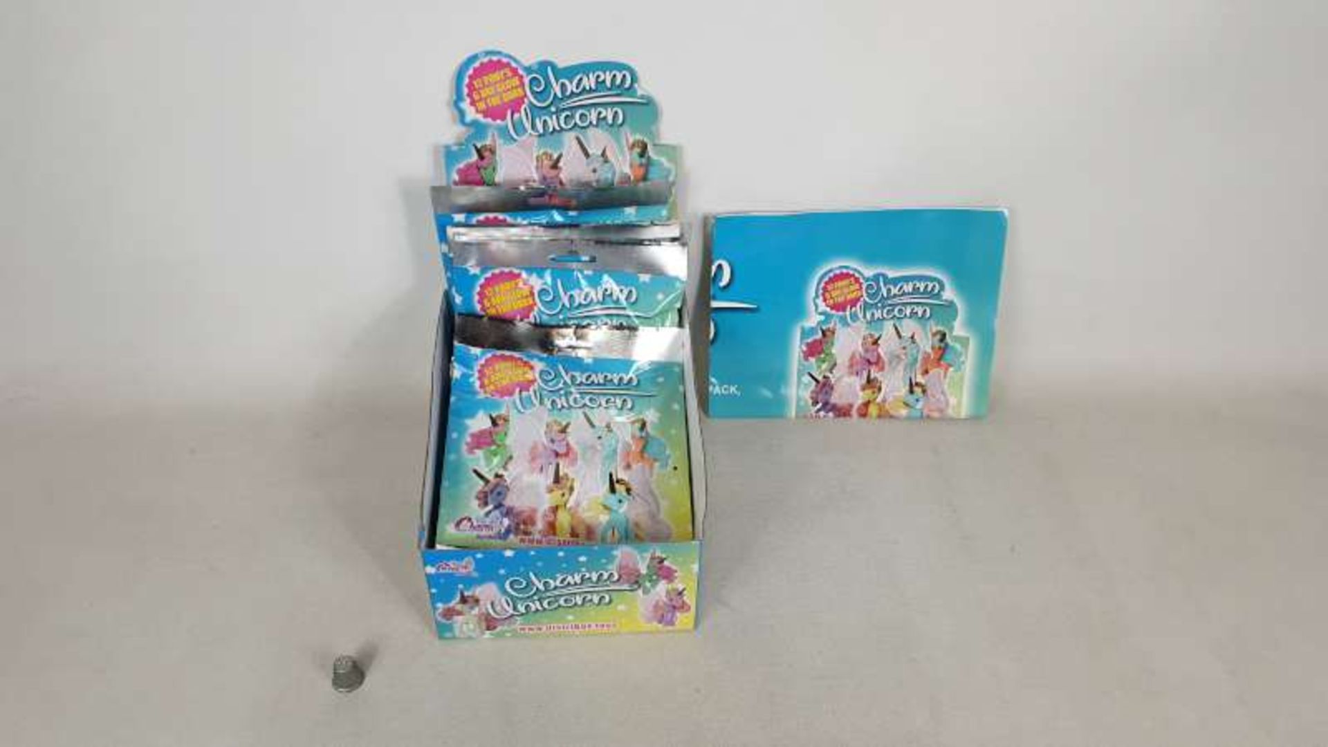 60 X COUNTER DISPLAY BOXES OF 12 UNICORN CHARMS IN 2 BOXES