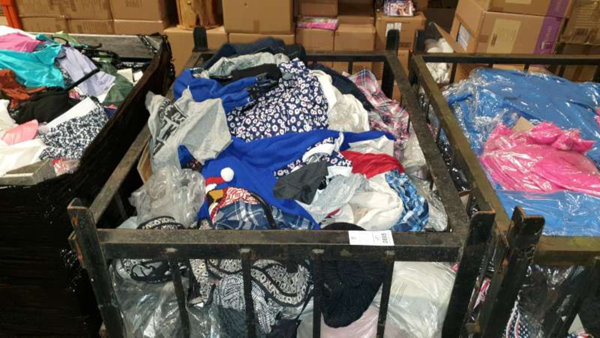 BOX PALLET CONTAINING A LARGE QUANTITY OF CLOTHING IN VARIOUS STYLES AND SIZES