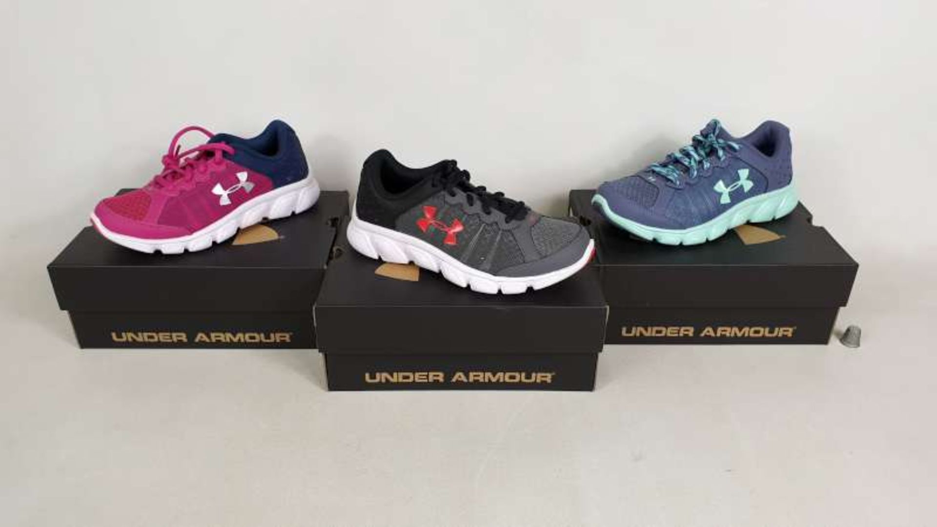 10 X BRAND NEW UNDER ARMOUR CHILDRENS TRAINERS IN VARIOUS STYLES AND SIZES