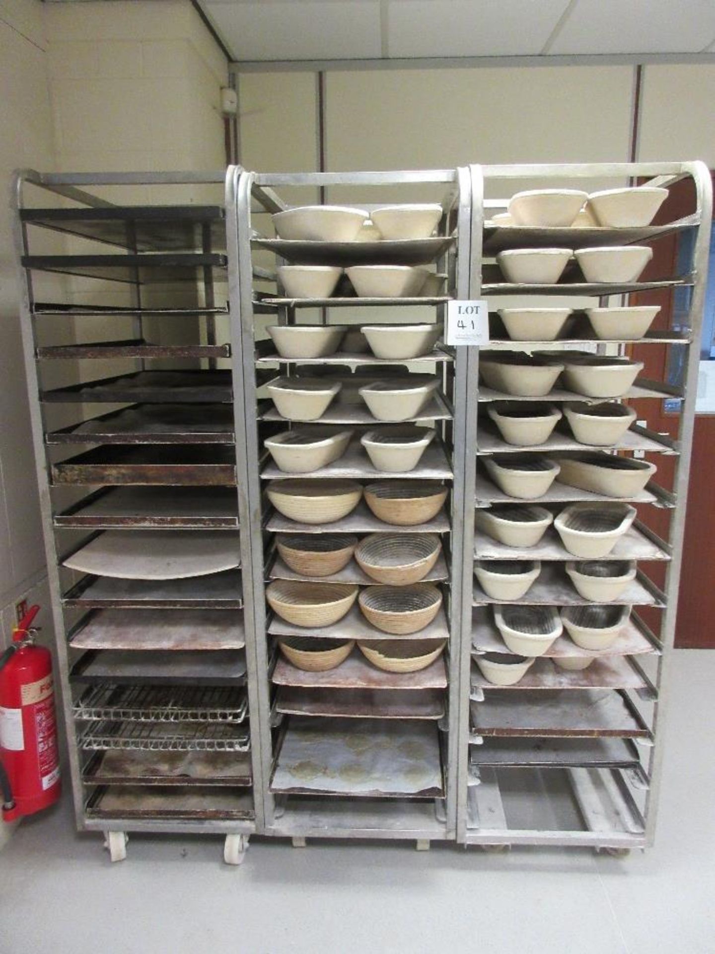 Three mobile multi-tier bread stands