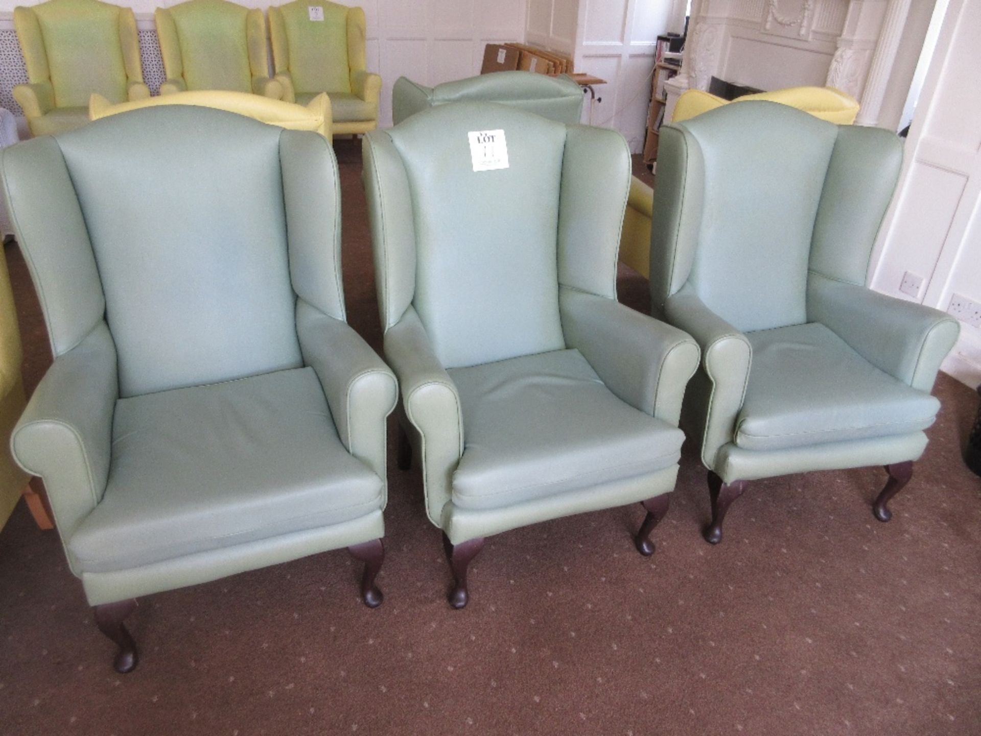 4 - Green vinyl based armchairs