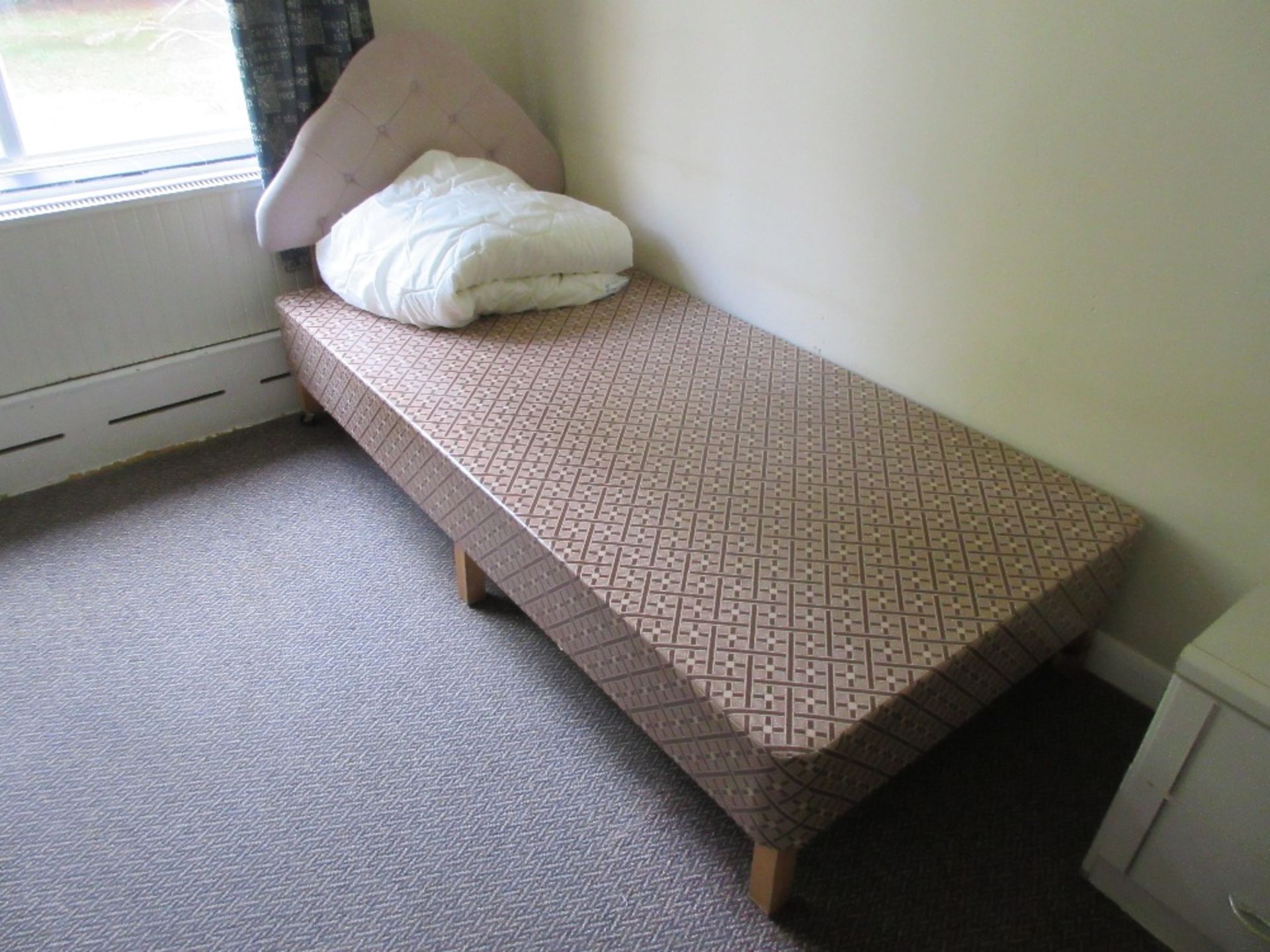 Contents of Room 29 to include bed base, commode on wheels, bedside table, wardrobe and remaining