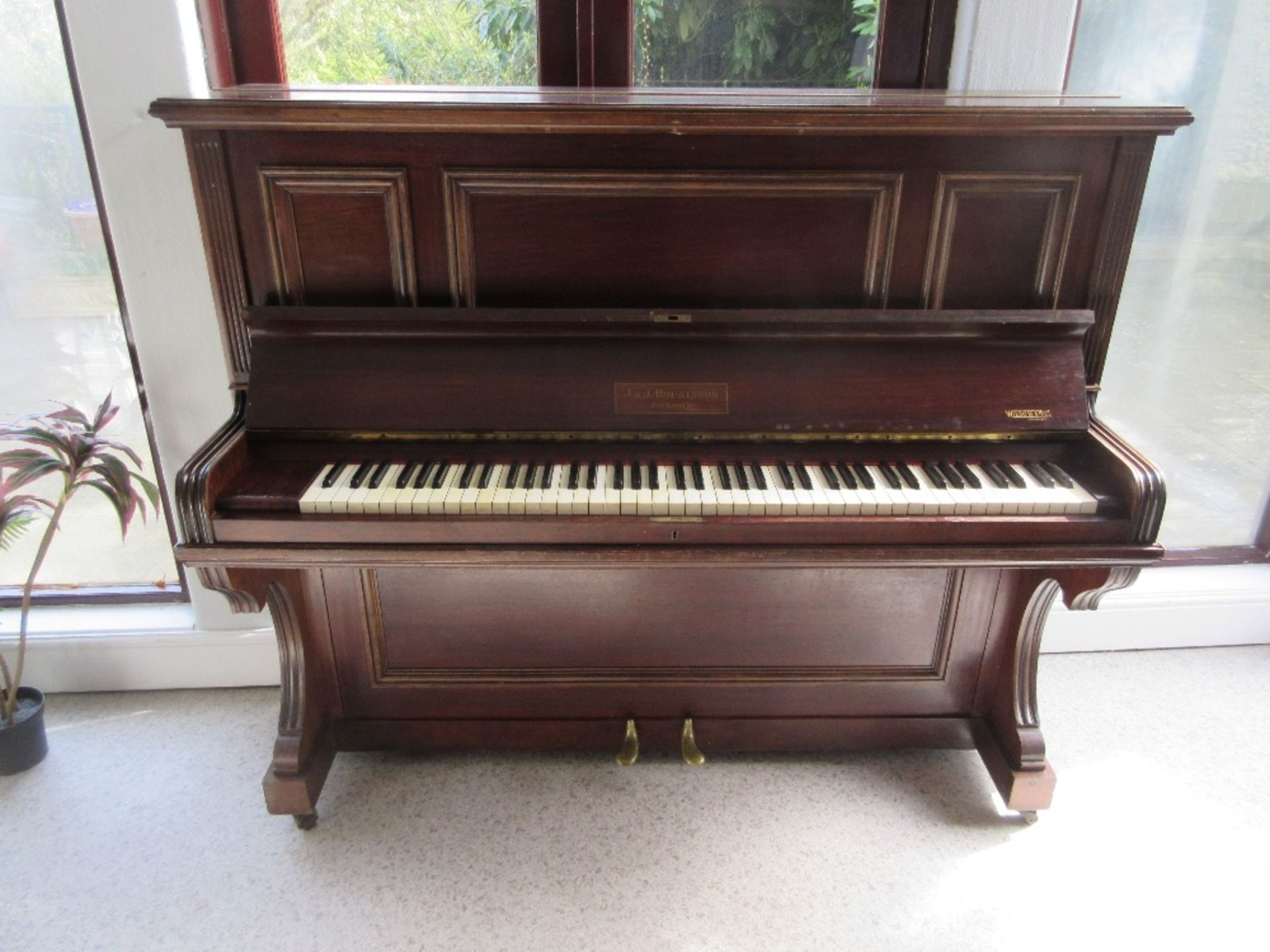 J & J Hopkins piano and remaining artwork in room, fan, plants