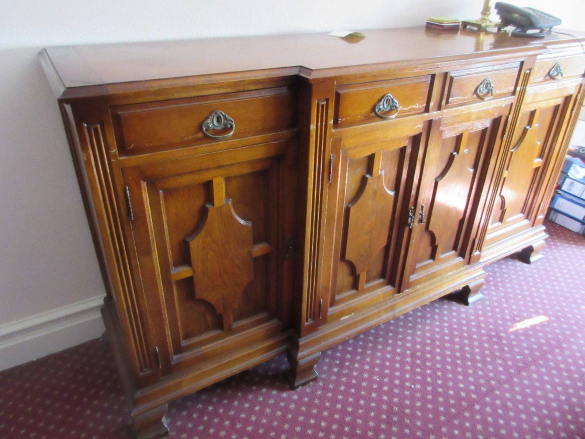 Oak sideboard incorporating four drawers over four cupboards