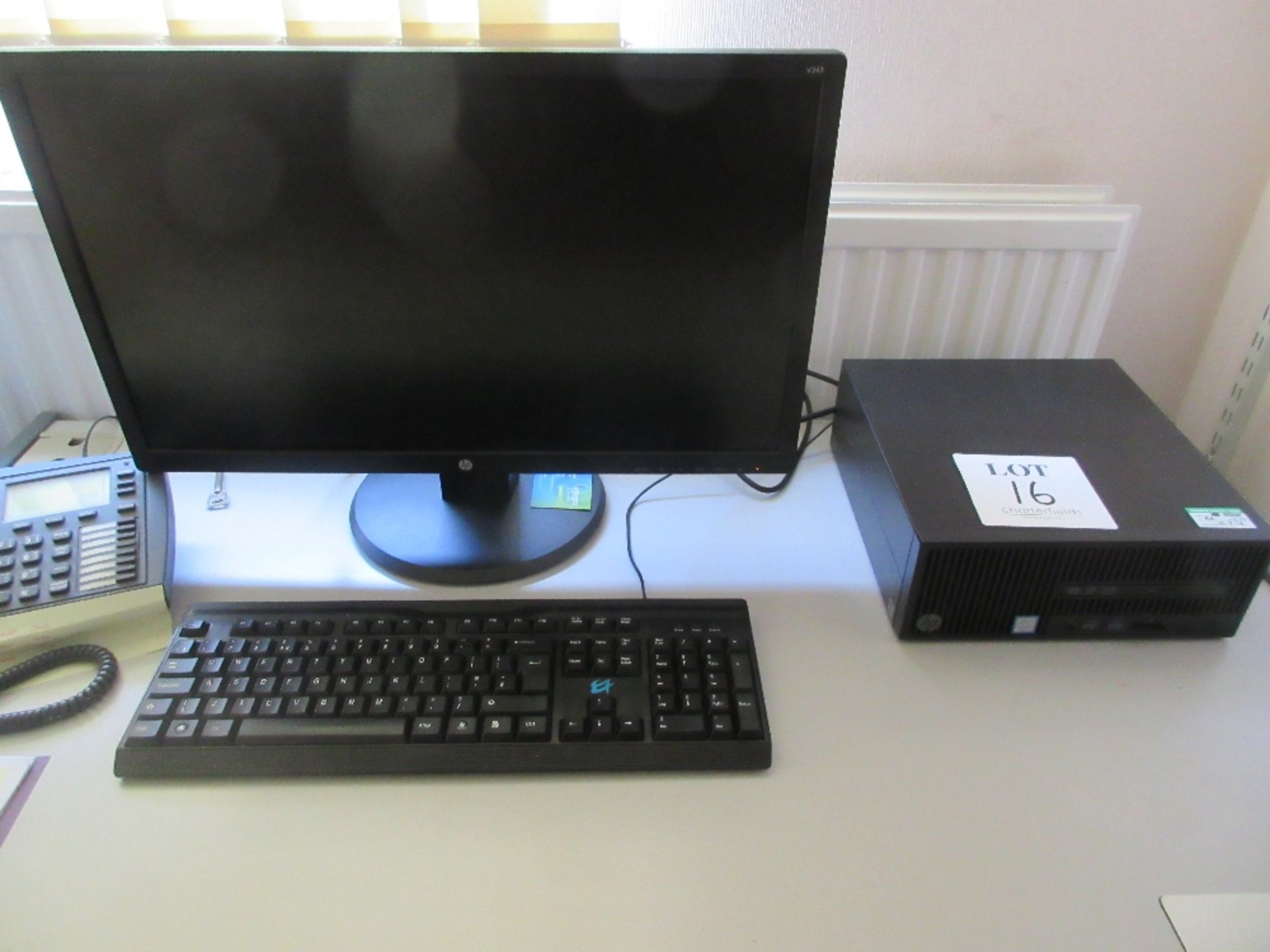 Hewlett Packard mini tower PC with flat screen monitor, keyboard and mouse incorporating I5-6500 pro