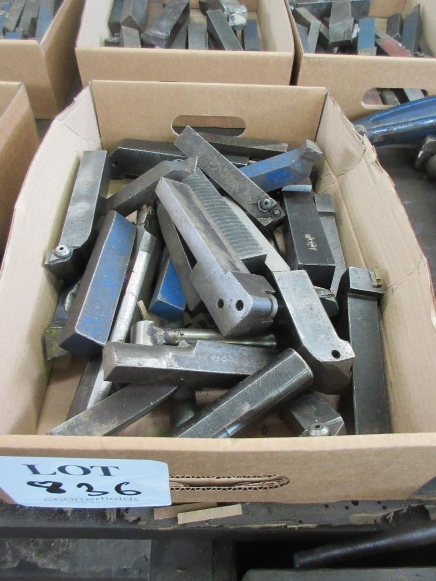 Box of various lathe cutting tools