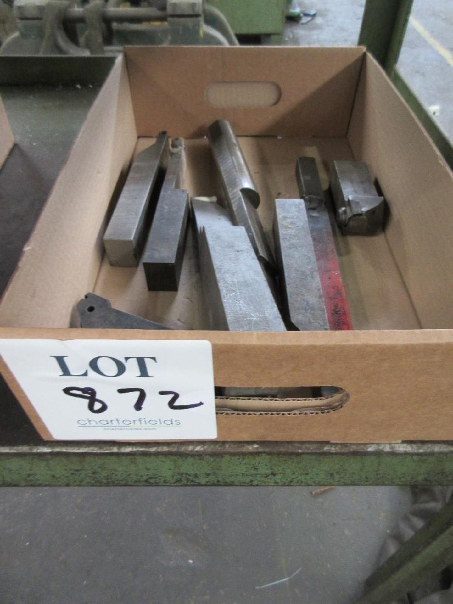 Box of various lathe cutting tools