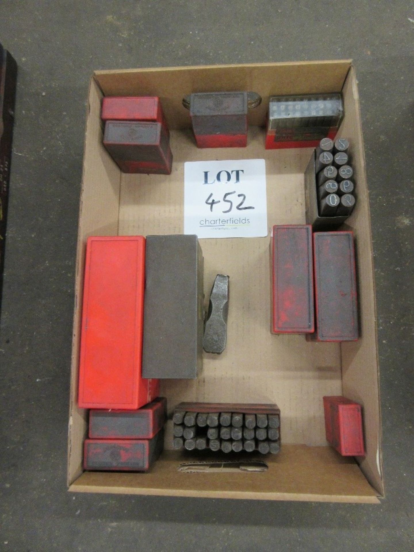 Box of several sets of number and letter stamps