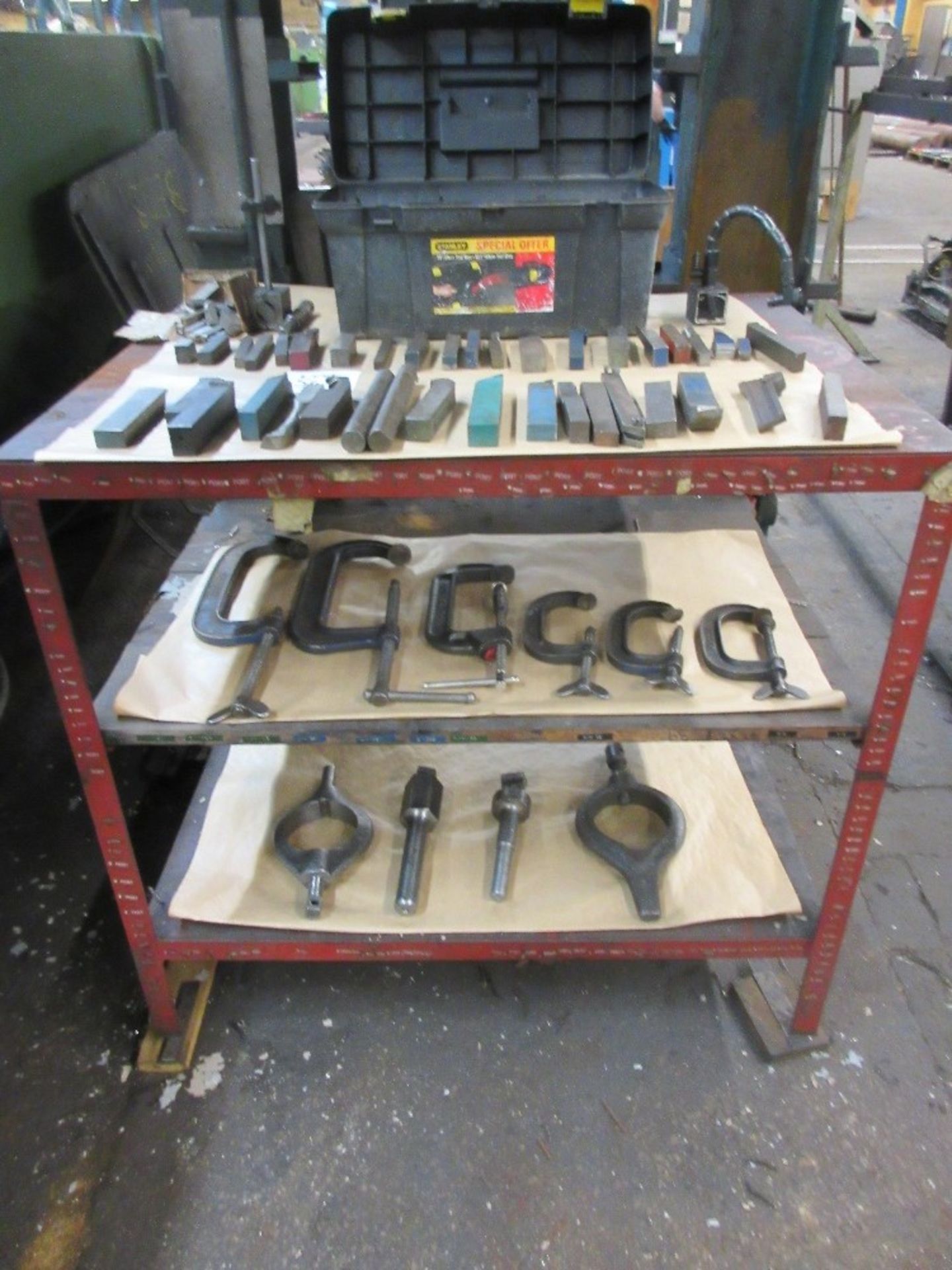 3 shelf stand containing 6 G clamps, various lathe tools and 2 - driving dogs