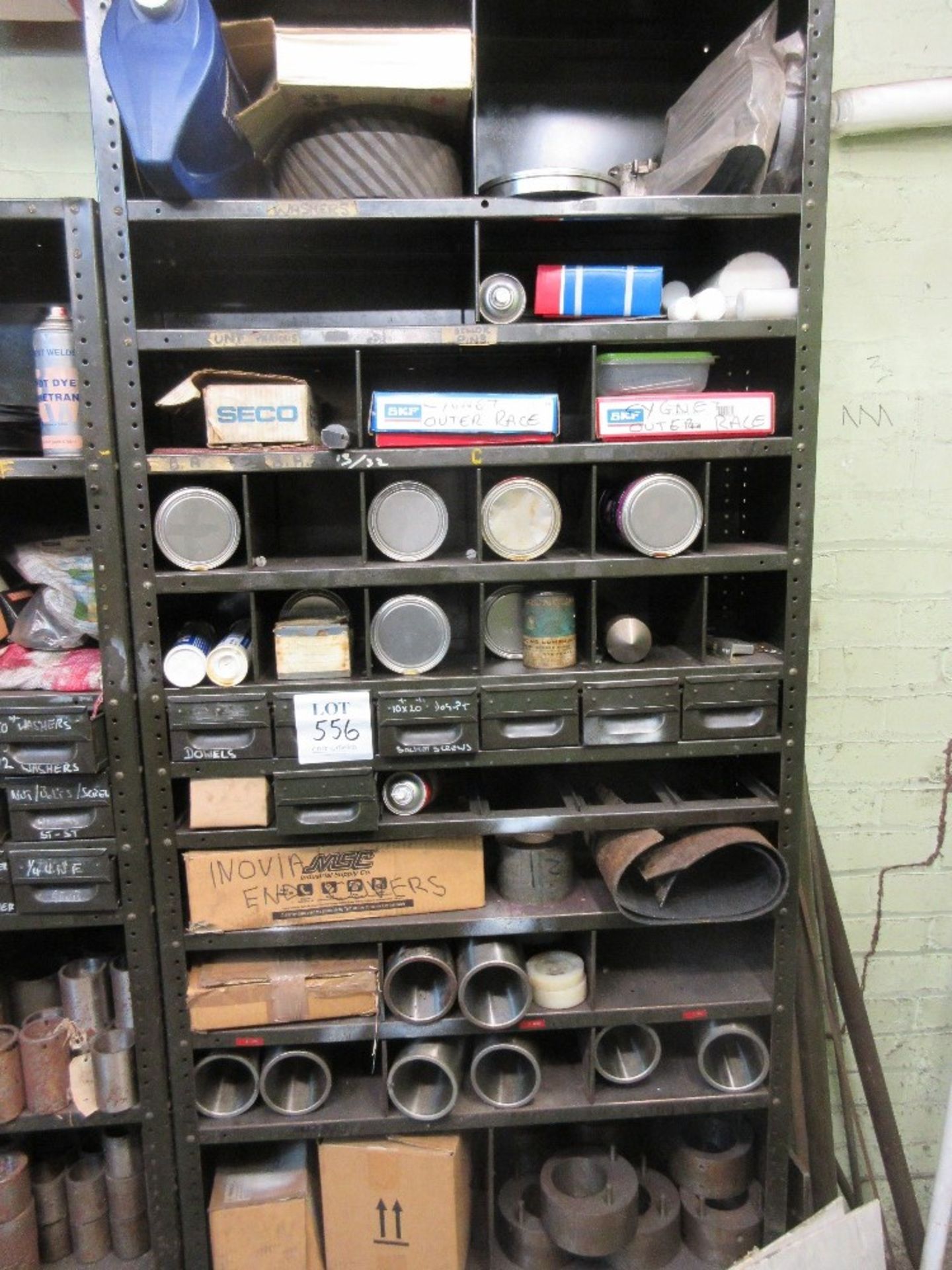 Cabinet containing Harden sleeves, cans of grease and various screws and fittings
