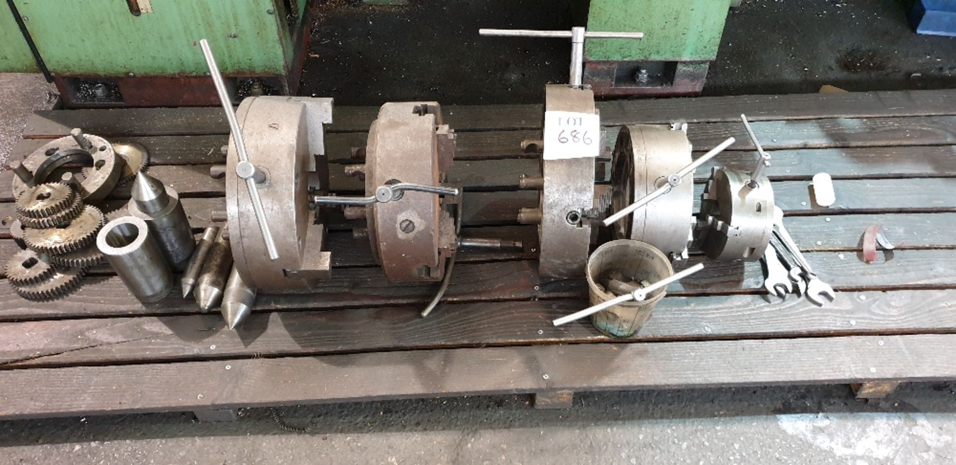 4 - 3 Jaw chucks, 1 - 4 jaw chuck and 4 dead centres