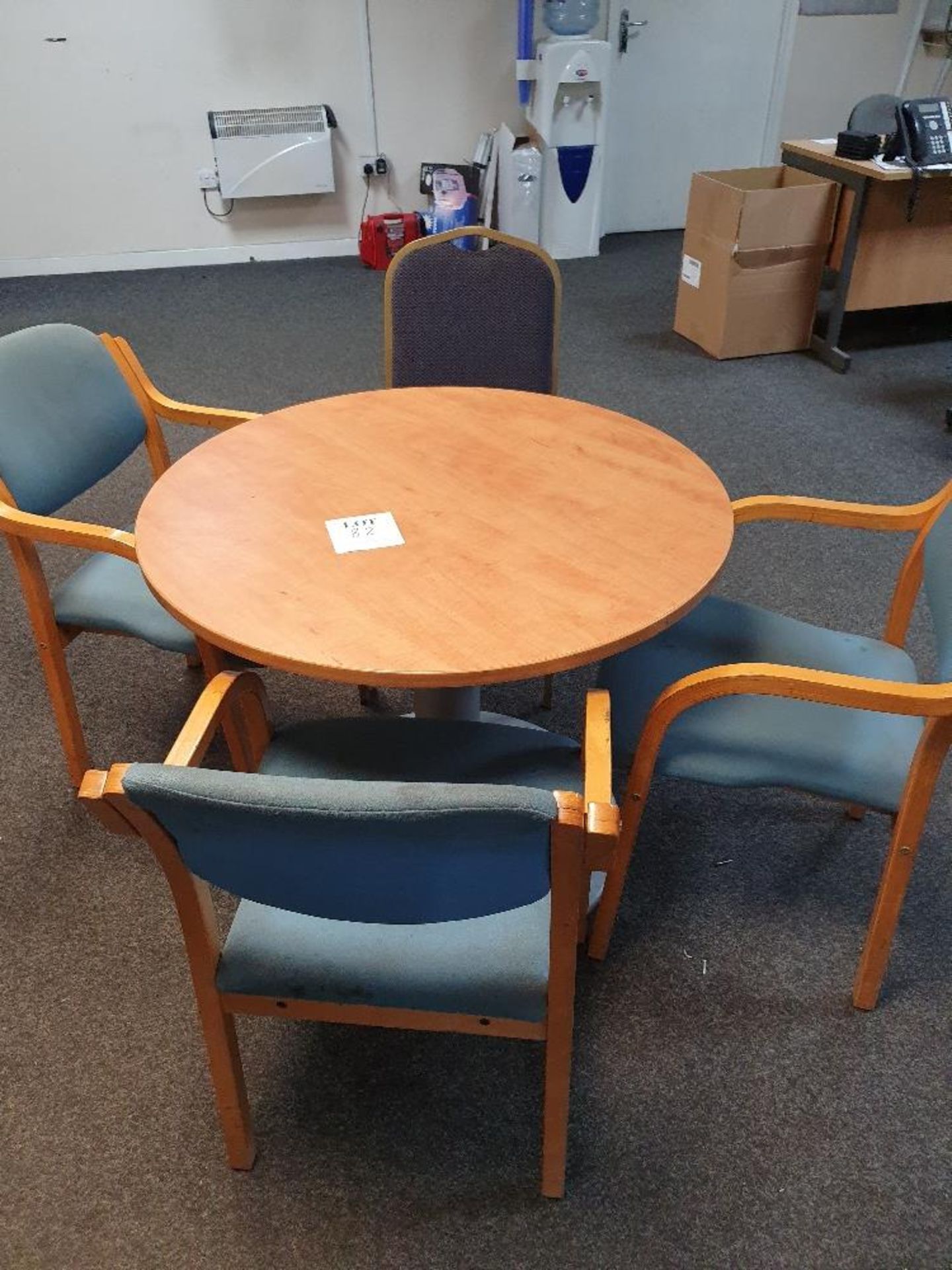 Round wooden table with 4 - fabric based chairs