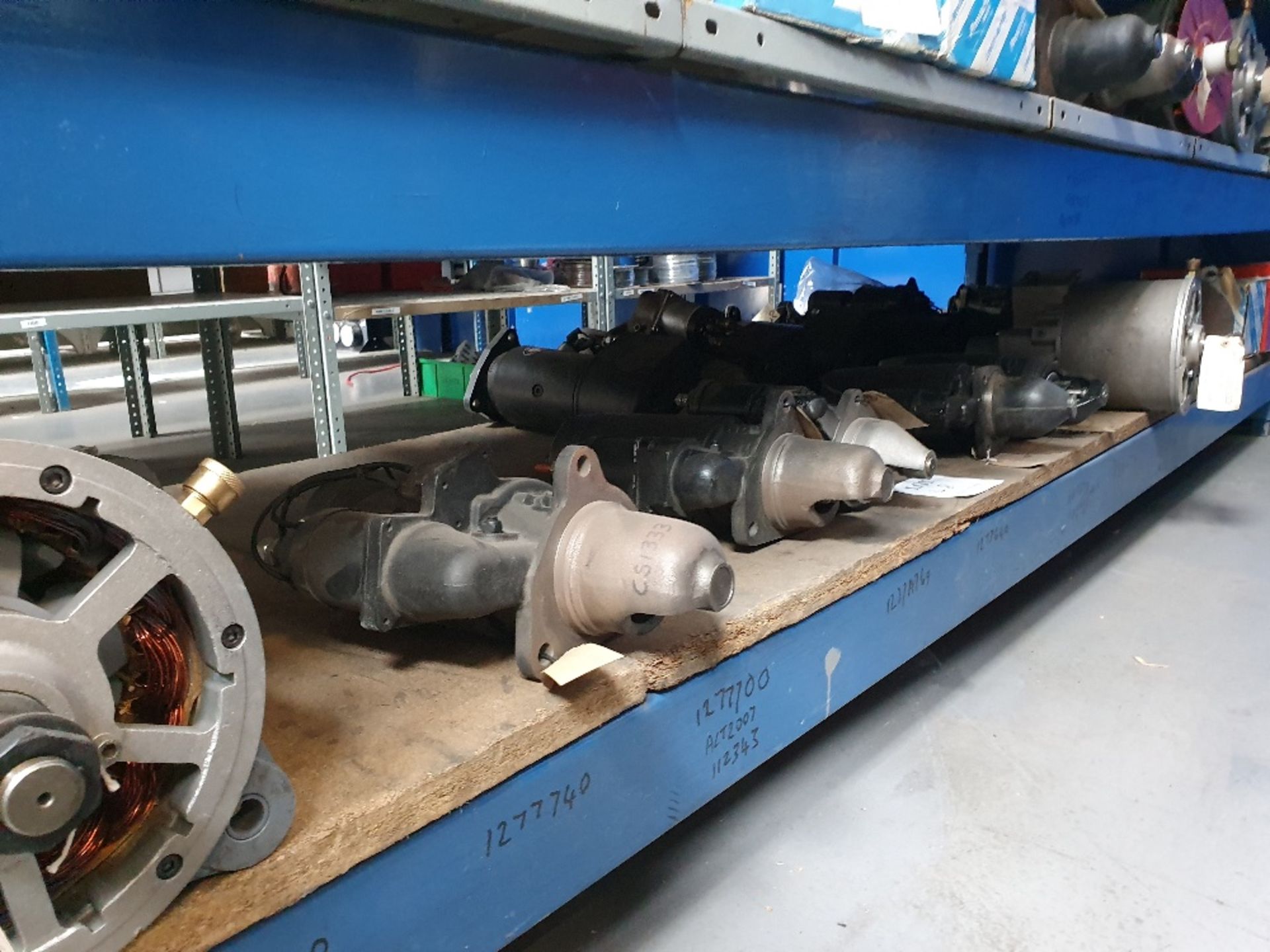 Shelf containing 11 starter motors