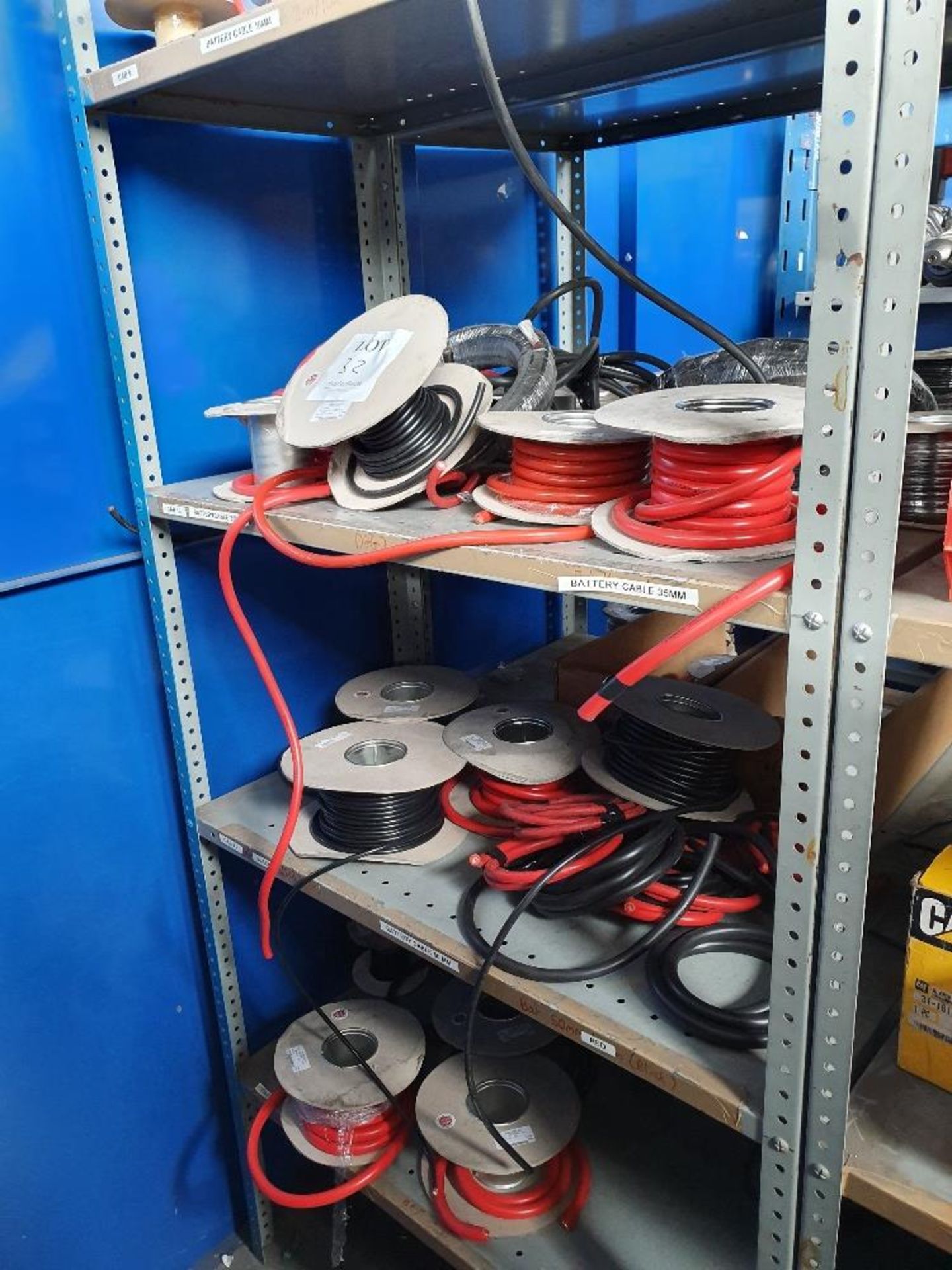 Rack containing assorted copper cable