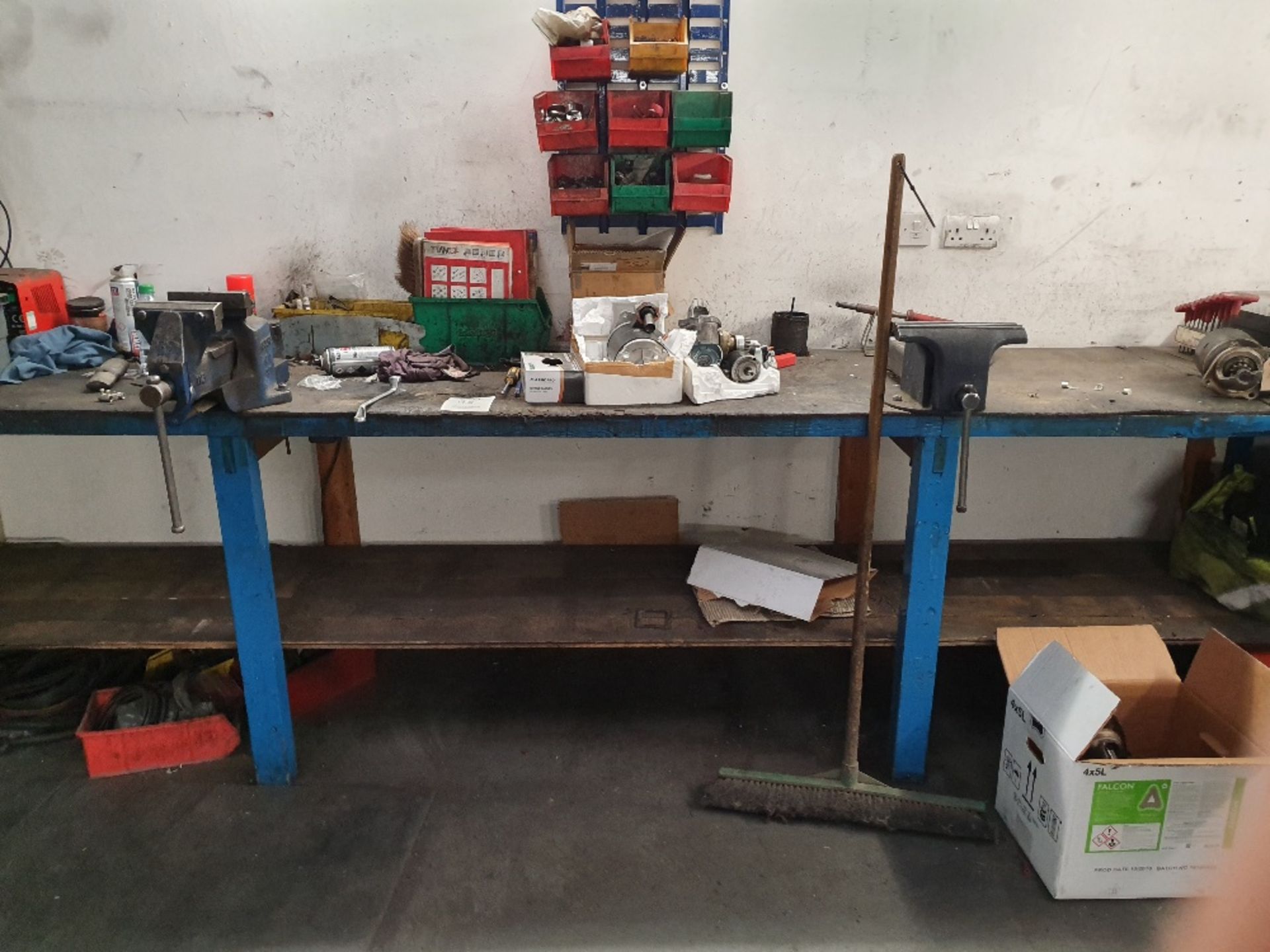 Bench with 2 - vice and contents of assorted spares