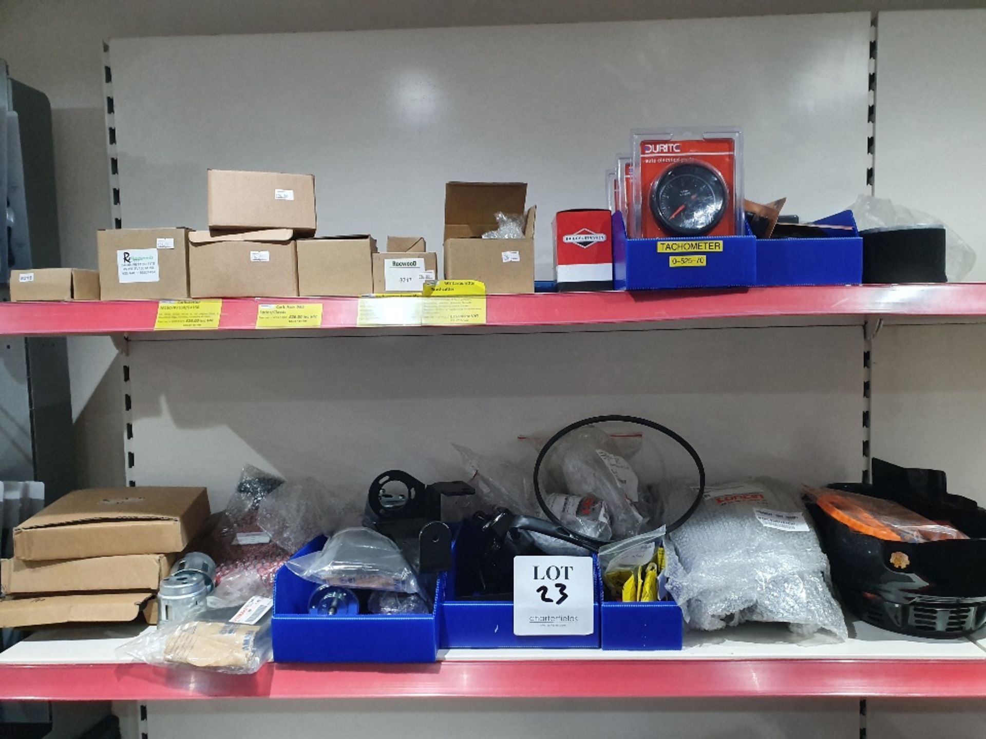 Contents of shelving to contain various lawnmower accessories