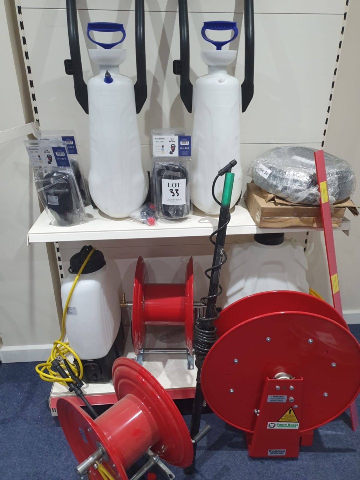 Contents of shelving to include spray pumps and reels