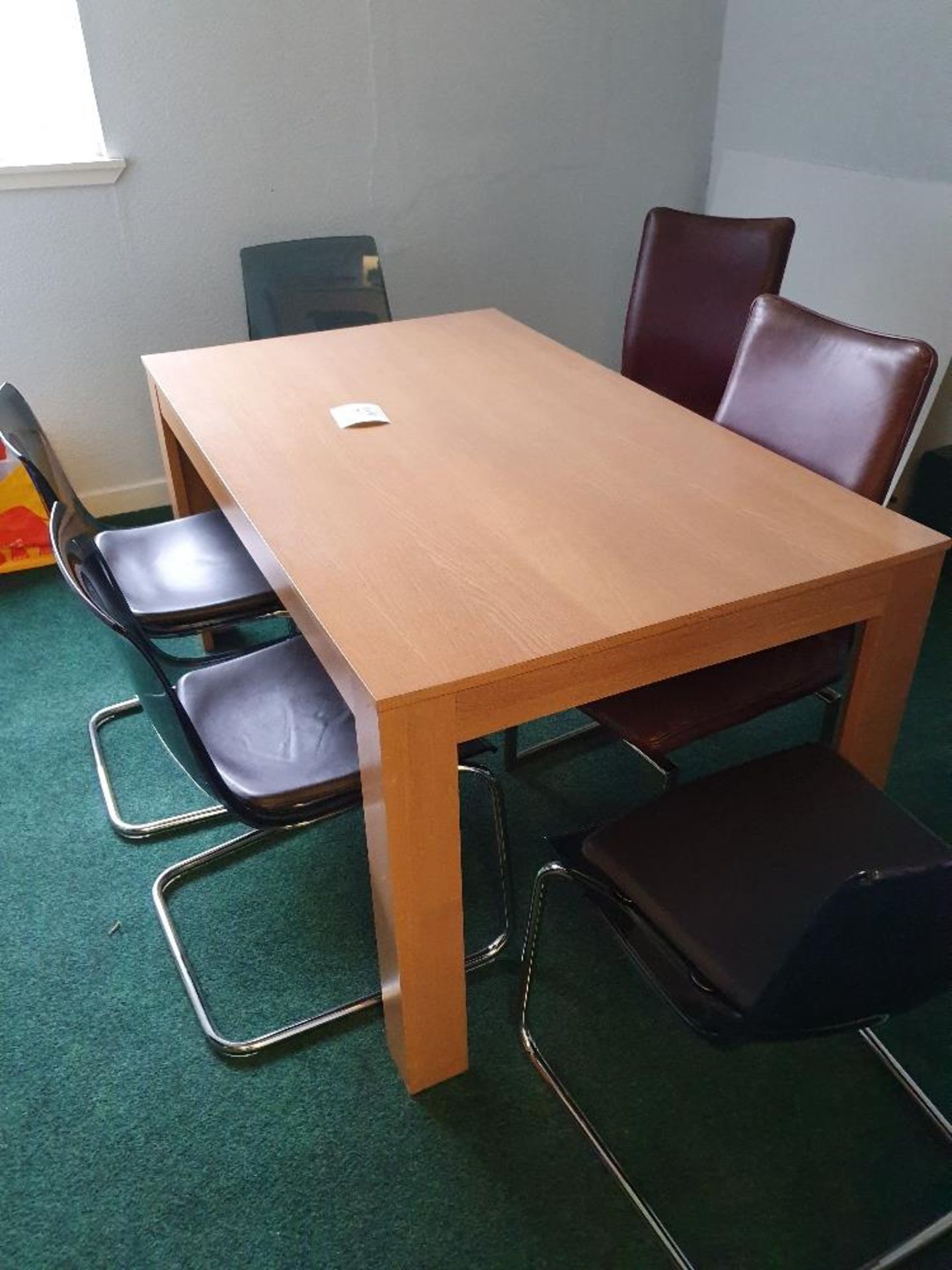 Table, wooden, approximately 59" x 36" x 30" high with 7 assorted chairs