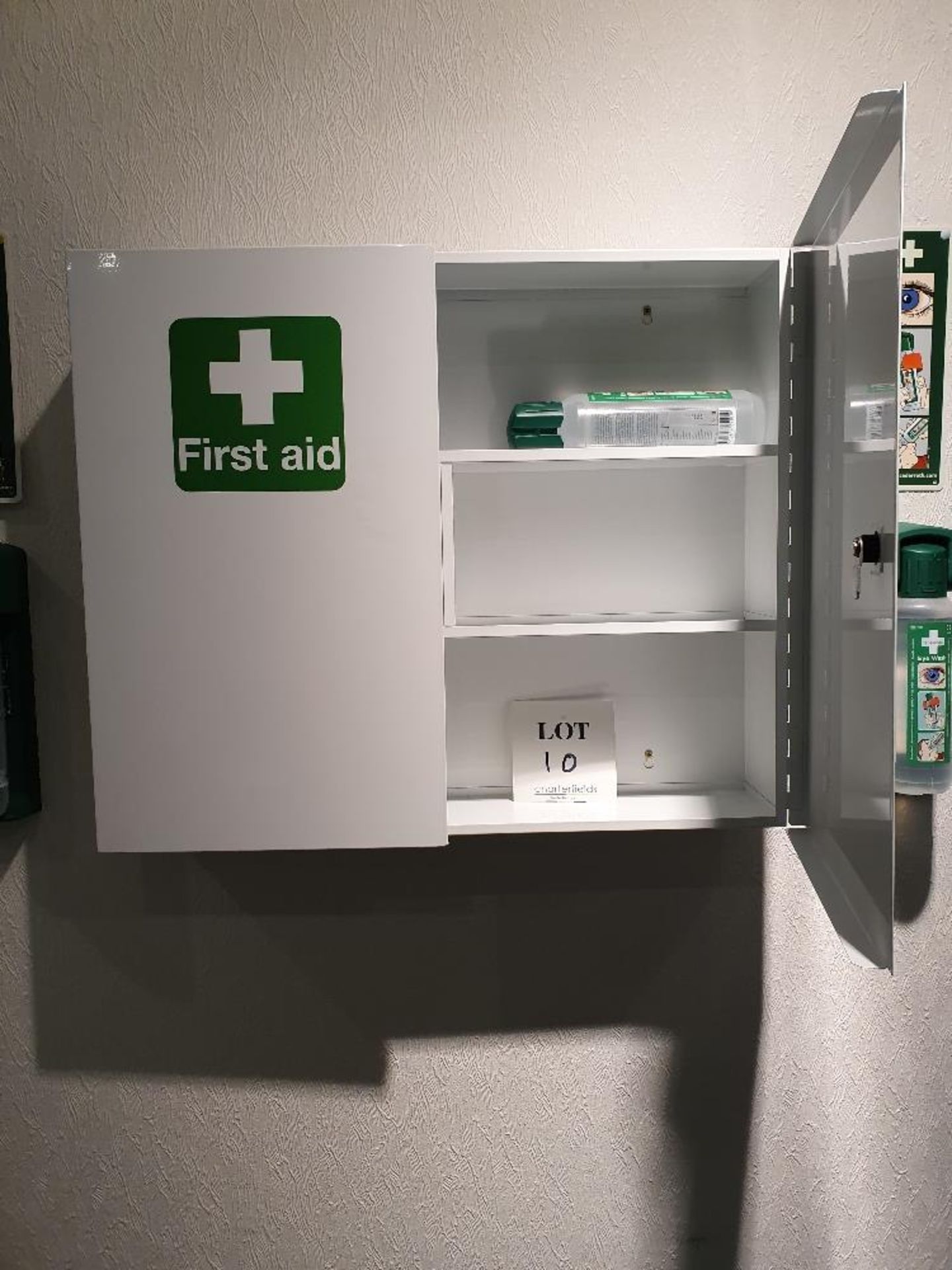 Wall mounted first aid cabinet