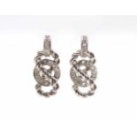 1 pair of earrings in 750 white gold with approx. 30 diamonds, total approx. 1 ct in high quality.