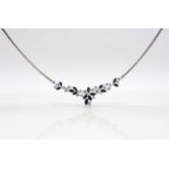 750 white gold necklace with 14 blue sapphires, total approx. 3.11 ct and 23 brilliants, total