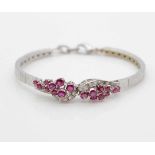 Bracelet in 585 white gold with 18 rubies, total ca. 2.02 ct and 16 diamonds, total ca. 0.27 ct,