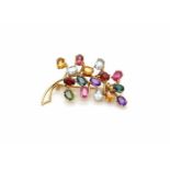 Brooch made of 750 gold with precious stones ( citrine, aquamarine, garnet, tourmaline in green