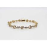 Bracelet in 585 gold and white gold with various brilliants, approx. 0.82 ct in medium quality.