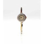 Ladies wristwatch tested for 750 gold and platinum with diamonds. weight 21,7 g, diameter 23,6 mm,
