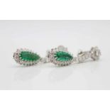 1 pair of earrings tested for platinum and 750 white gold with one emerald, 1.8 ct and 1.9 ct each