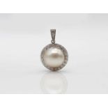 Pendant in 585 white gold with diamonds, total ca. 0.45 ct and a Mabe pearl. weight 4,4 g,