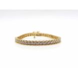 Bracelet 585 gold with 45 diamonds, ca. 0,22 ct. weight 14,1 g, length 17,5 cm- - -15.00 % buyer's